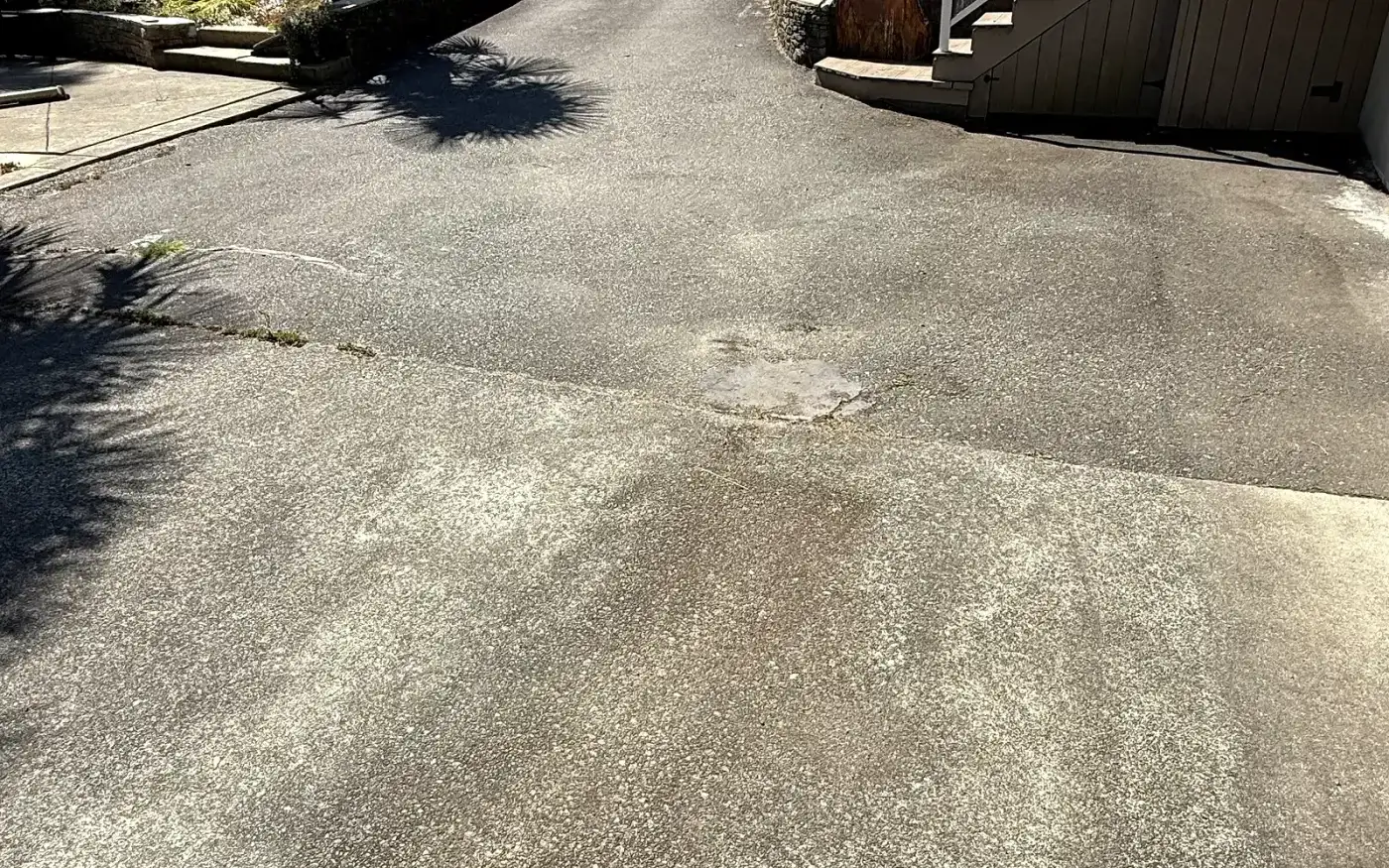 Same driveway before sealing, faded and cracked